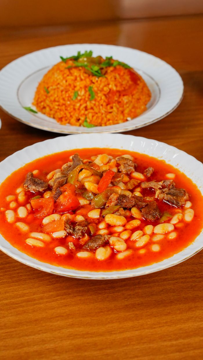 services-01 Traditional Turkish bean stew with rice pilaf served in Niğde, Türkiye, showcasing local culinary flavors.
